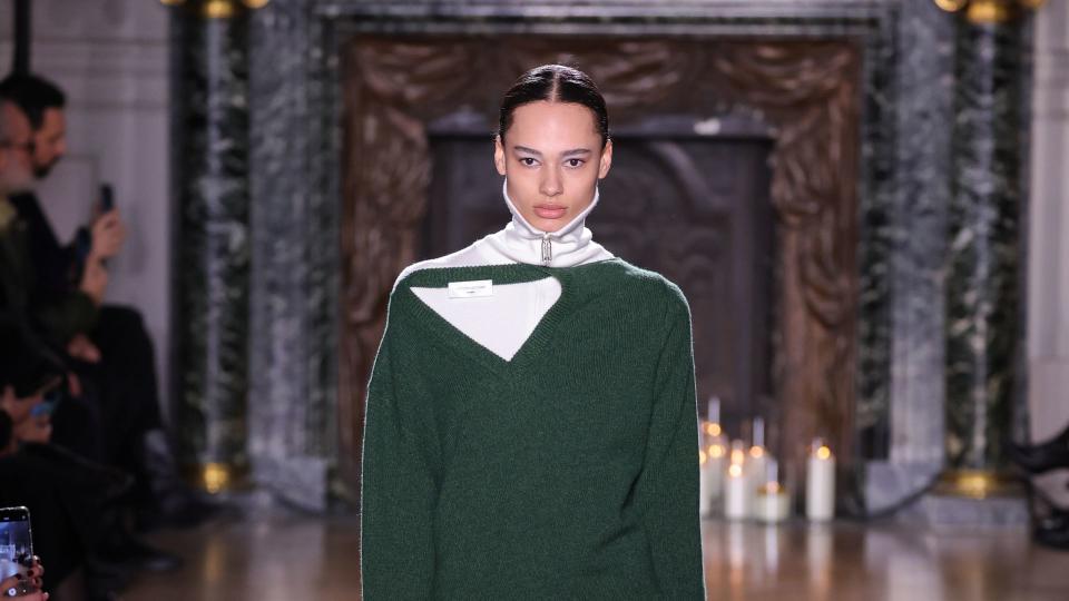 A model walks the runway during the Victoria Beckham Womenswear Fall/Winter 2024-2025 show in a green jumper