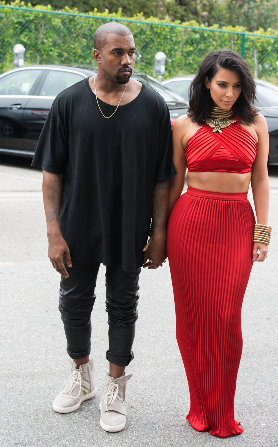 Kim Kardashian and Kanye West wearing black and red Roc Nation