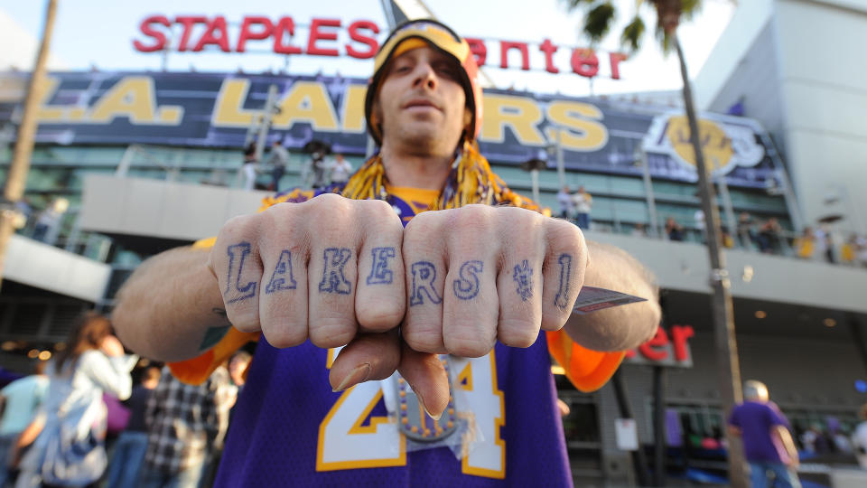 LOS ANGELES, CA - MAY 19: A Los Angeles Lakers fan poses for a photograph before the team played the Oklahoma City Thunder in Game Four of the Western Conference Semifinals during the 2012 NBA Playoffs at Staples Center on May 19, 2012 in Los Angeles, California. NOTE TO USER: User expressly acknowledges and agrees that, by downloading and/or using this Photograph, user is consenting to the terms and conditions of the Getty Images License Agreement. Mandatory Copyright Notice: Copyright 2012 NBAE (Photo by Andrew D. Bernstein/NBAE via Getty Images)