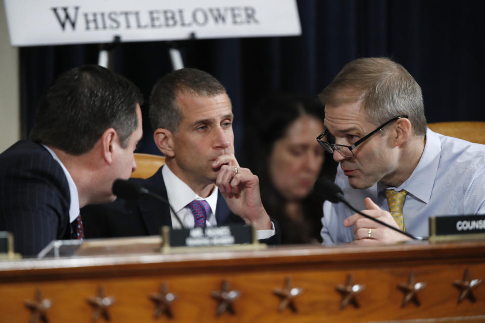 Ranking member Rep. Devin Nunes of Calif.,left, Steve Castor, the Republican staff attorney, center, and Rep. Jim Jordan, R-Ohio, huddle as U.S. Ambassador to the European Union Gordon Sondland testifies before the House Intelligence Committee on Capitol Hill in Washington, Wednesday, Nov. 20, 2019, during a public impeachment hearing of President Donald Trump's efforts to tie U.S. aid for Ukraine to investigations of his political opponents. (AP Photo/Alex Brandon)