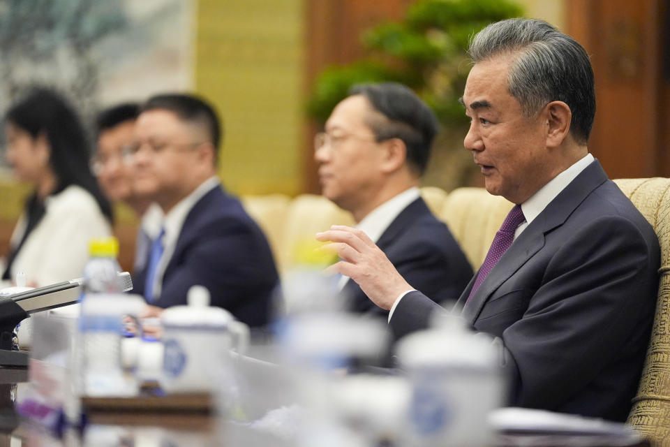 China's Foreign Minister Wang Yi gestures to U.S. Secretary of State Antony Blinken during their meeting at the Diaoyutai State Guesthouse, Friday, April 26, 2024, in Beijing, China. (AP Photo/Mark Schiefelbein, Pool)