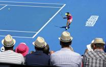 Spectators wearing hats watch as Madison Keys of the U.S. hits a return to compatriot Venus Williams during their women's singles quarter-final match at the Australian Open 2015 tennis tournament in Melbourne January 28, 2015. Keys defeated Venus to win the match. REUTERS/Brandon Malone (AUSTRALIA - Tags: SPORT TENNIS)