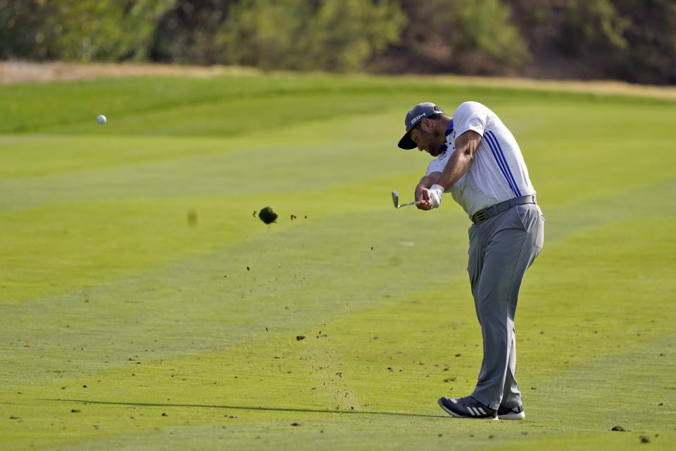 John Rahm hits from the ninth fairway during the first round of the Zozo Championship golf tournament Thursday, Oct. 22, 2020, in Thousand Oaks, Calif. (AP Photo/Marcio Jose Sanchez)