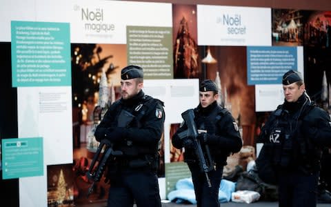 French police officers patrol in the streets of Strasbourg following an attack killing three persons and wounding at least 13, in Strasbourg, eastern France - Credit: Christophe Ena/AP