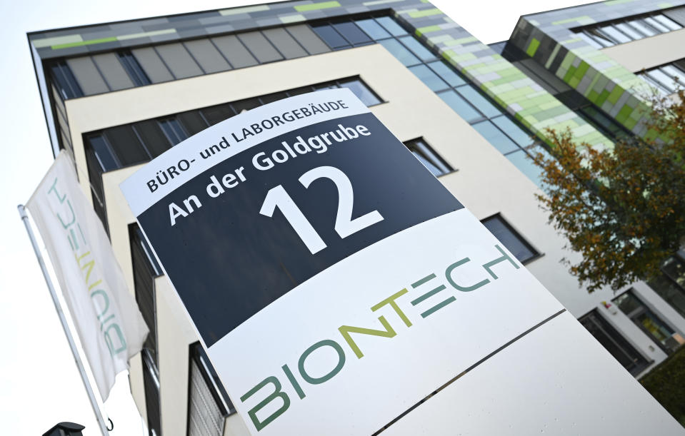 In this Monday, Nov. 9, 2020 photo, the company sign of BioNtech stands in front of the companies headquarters in Mainz, Germany. Pfizer and BioNTech say they've won permission Wednesday, Dec. 2, 2020, for emergency use of their COVID-19 vaccine in Britain, the world’s first coronavirus shot that’s backed by rigorous science -- and a major step toward eventually ending the pandemic. (Arne Dedert/dpa via AP)