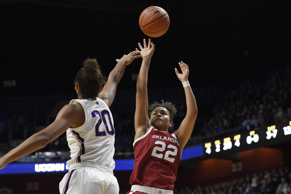 Oklahoma's Ana Llanusa (22) shoots over Connecticut's Olivia Nelson-Ododa (20) in the first half of an NCAA college basketball game, Sunday, Dec. 22, 2019, in Uncasville, Conn. (AP Photo/Jessica Hill)