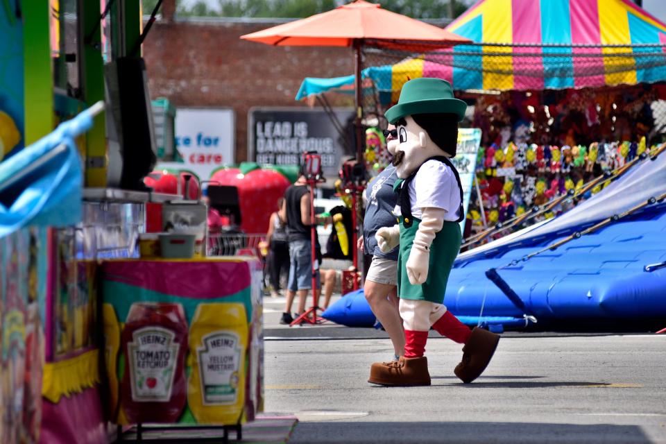 The new Brattie mascot walks through town Thursday during the 2023 Bucyrus Bratwurst Festival.