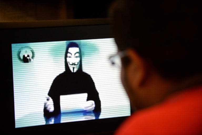 A spokesman for Anonymous issues a warning through a video posted online, on November 1, 2013