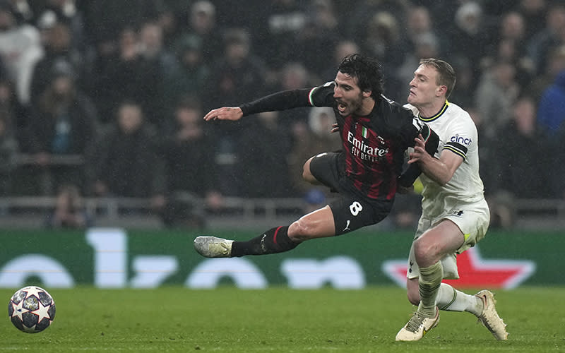 Tottenham's Oliver Skipp, right, challenges AC Milan's Sandro Tonali during the Champions League round of 16 second leg soccer match