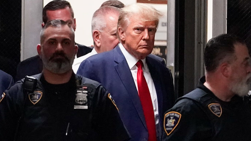 Former President Donald Trump enters a Manhattan court, Tuesday, April 4, 2023, in New York. (Getty)