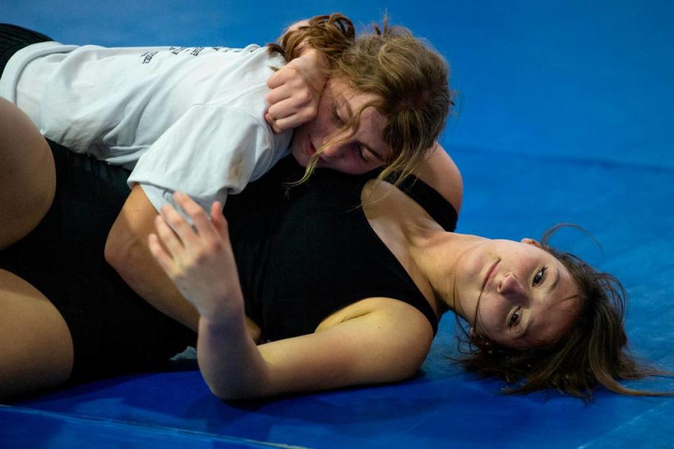 Addysin Mollendor and Anavey Best practice wrestling moves on each other during Ocean Springs’ high school wrestling practice at E.H. Keys Alternative Education Center on Thursday, Feb. 8, 2024.