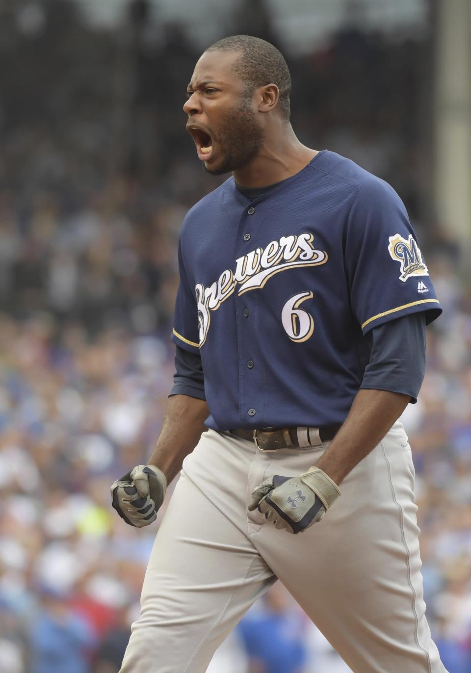 Milwaukee Brewers' Lorenzo Cain reacts to his RBI single in the eighth inning of a tiebreak baseball game against the Chicago Cubs on Monday, Oct. 1, 2018, in Chicago. (John Starks/Daily Herald via AP)