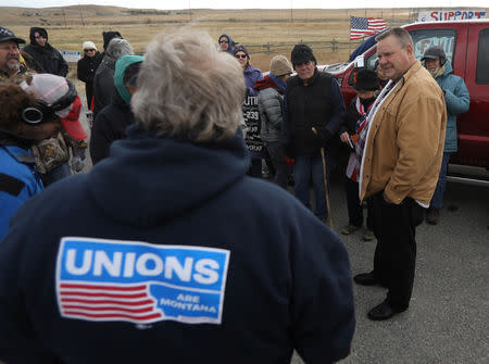 U.S. Senator Jon Tester meets with striking members of the International Boilermakers Union Local D239 and their supporters outside Imerys Talc America Inc. in Three Forks, Montana, U.S., October 13, 2018. REUTERS/Jim Urquhart