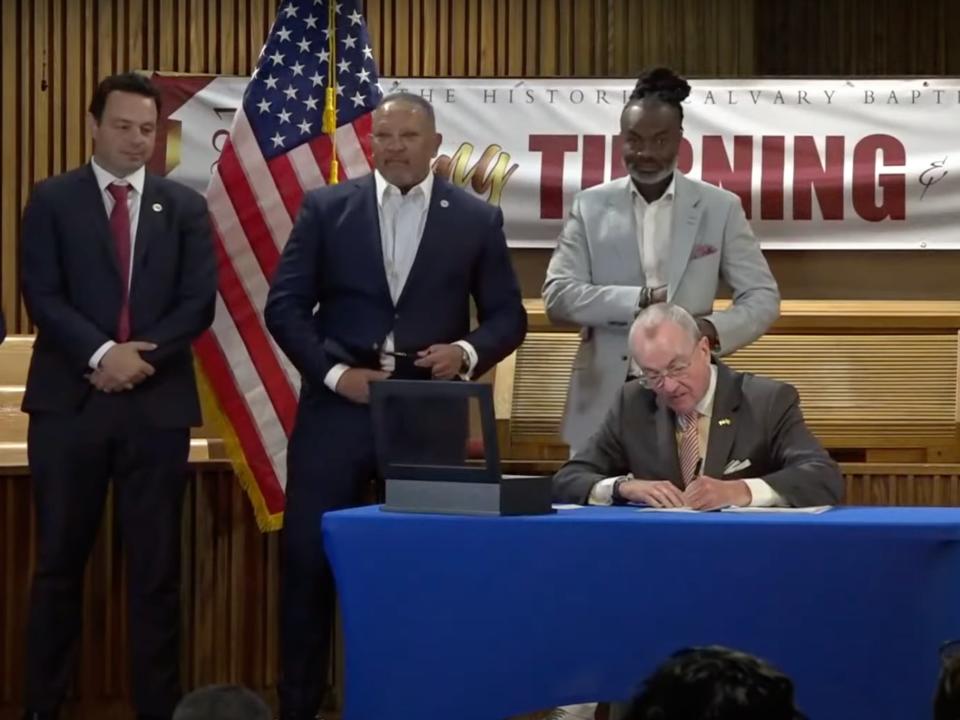 Democratic New Jersey Governor Phil Murphy signs the Fair Chance in Housing Act on 18 June 2021.  (The office of the governor of New Jersey)