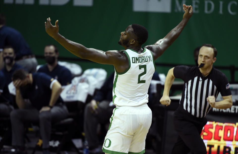 Oregon forward Eugene Omoruyi (2) celebrates after making a three-point basket against Arizona during the first half of an NCAA college basketball game Monday, March 1, 2021, in Eugene, Ore. (AP Photo/Andy Nelson)