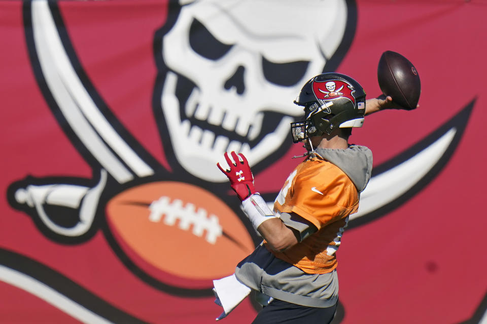 Tampa Bay Buccaneers quarterback Tom Brady (12) throws a pass during an NFL football practice Wednesday, Jan. 6, 2021, in Tampa, Fla. The Buccaneers play the Washington Football Team in a playoff game Saturday night. (AP Photo/Chris O'Meara)