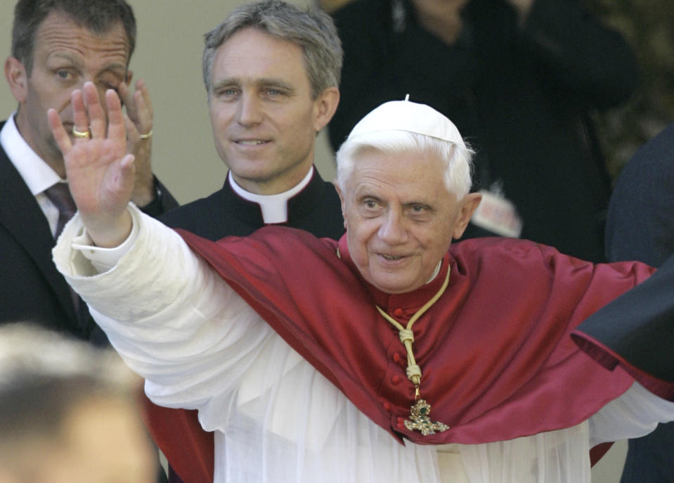 FILE - Pope Benedict XVI greets the faithful in front of the Old Chapell in Regensburg, southern Germany, Sept. 13, 2006. Pope Benedict XVI leaves his homeland with a complicated legacy: pride in a German pontiff but a church deeply divided over the need for reforms in the wake of a sexual abuse scandal in which his own actions of decades ago were faulted. (AP Photo/Thomas Kienzle, File)