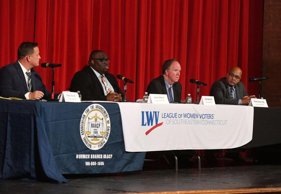 Robert Bell, left, and Derell Wilson debate for the 46th house district and incumbent Kevin Ryan and Mark Adams debate for the 139th house district October 19, 2022 at Norwich Free Academy.