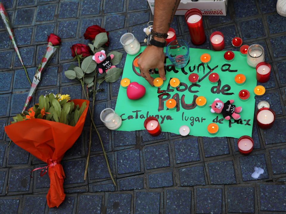 Memorials were placed at the scene where suspected terrorists crashed a van into pedestrians at Las Ramblas in Barcelona: REUTERS