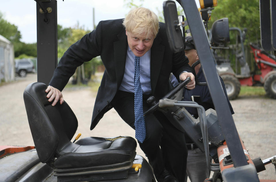 Conservative Party leadership candidate Boris Johnson in a fork lift truck during a visit to King & Co tree nursery, in Braintree, Essex, ahead of a Tory leadership hustings, England, Saturday, July 13, 2019. (Neil Hall/Pool photo via AP)