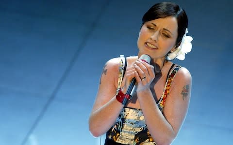 Dolores O'Riordan performing at the San Remo Song Festival in 2004 - Credit: Reuters