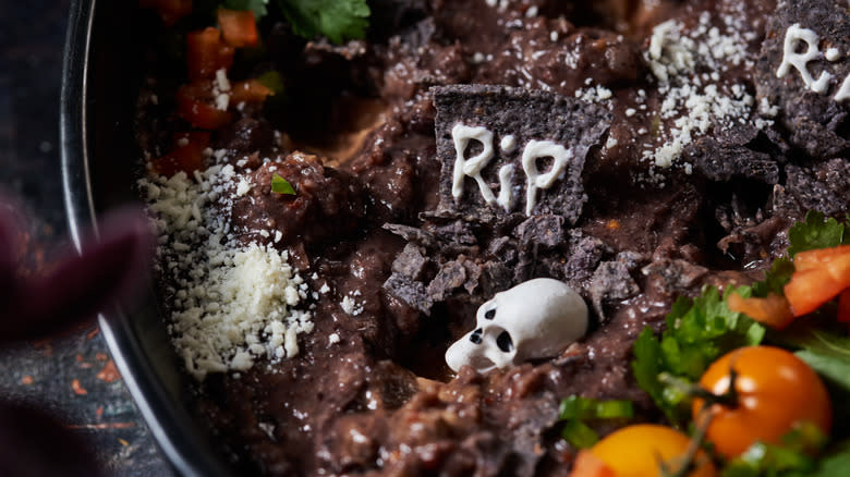 bean dip with tortilla tombstones