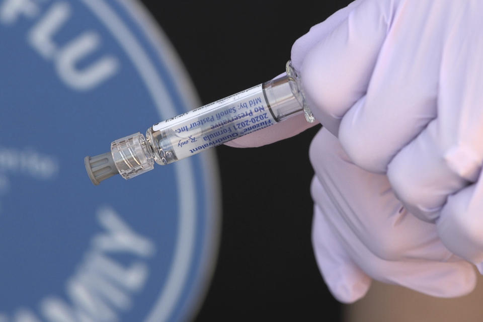 A flu vaccine is prepared to give to National Foundation for Infectious Diseases (NFID) staff members in Bethesda, Md., on Wednesday, Sept. 30, 2020. (AP Photo/Federica Narancio)