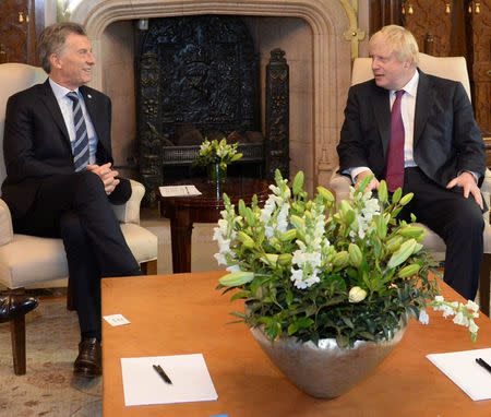 Argentine President Mauricio Macri and Britain's Foreign Secretary Boris Johnson talk during a meeting at the Casa Rosada Presidential Palace in Buenos Aires, Argentina May 22, 2018. Argentine Presidency/Handout via REUTERS