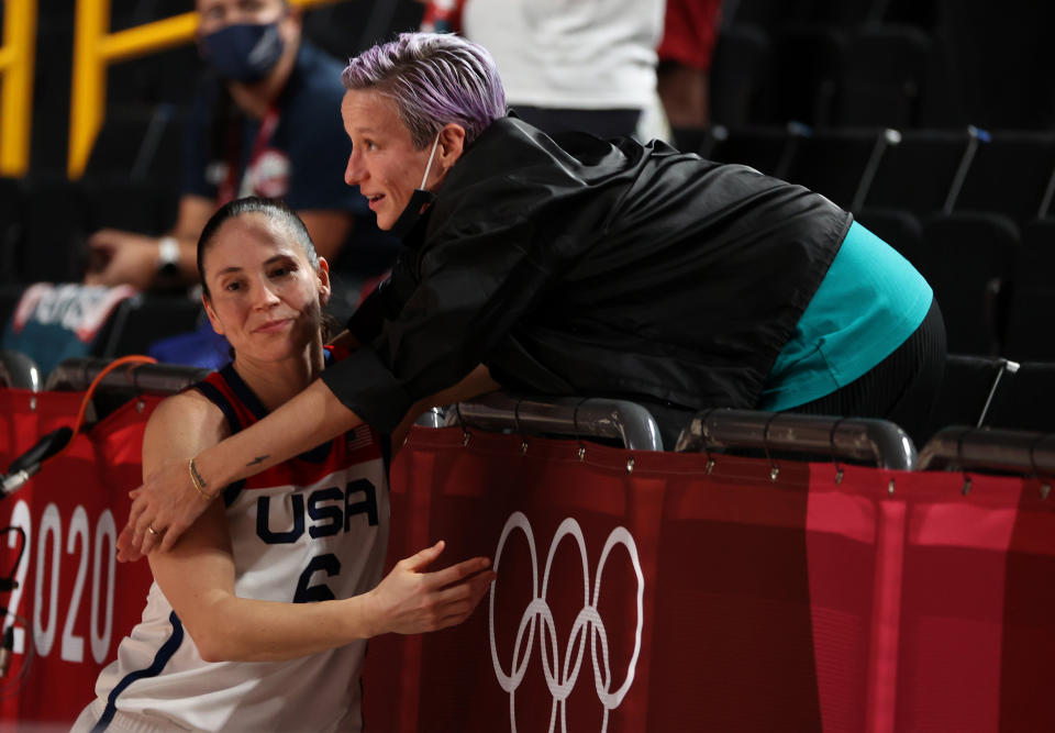 Megan Rapinoe congratulates Sue Bird #6 of Team United States after the United States' win over Japan in the Women's Basketball final game on day sixteen of the 2020 Tokyo Olympic games at Saitama Super Arena on August 08, 2021. (Kevin C. Cox / Getty Images)