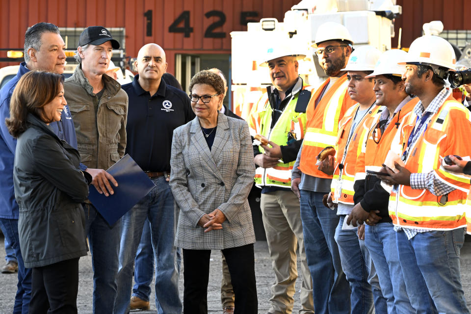 Vice President Kamala Harris, left, greets freeway construction workers with Sen. Alex Padilla, California Gov. Gavin Newsom, third from left, and Los Angeles Mayor Karen Bass, center, and congratulates them on the I-10 freeway, which was closed by an underpass fire on Saturday, Nov. 11, 2023, in Los Angeles, Sunday, Nov. 19. (AP Photo/Alex Gallardo, Pool)