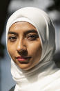 Ameena Ahmed poses for a photo, Tuesday, July 27, 2021, in the Brooklyn borough of New York. After her work as a substitute teacher in New York City dried up, Ameena Ahmed got a welcome $4,200 boost last summer in federal pandemic-related unemployment benefits.Then New York state started taking it back. (AP Photo/Eduardo Munoz Alvarez)