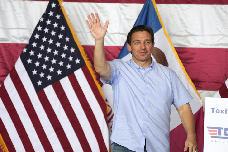 Republican presidential candidate Florida Gov. Ron DeSantis waves as he walks on stage to speak during U.S. Rep. Zach Nunn's Annual BBQ, Saturday, July 15, 2023, in Ankeny, Iowa. (AP Photo/Charlie Neibergall)