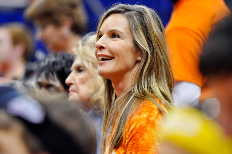 Julie Boeheim, wife of Syracuse head coach Jim Boeheim watches as the Syracuse NCAA basketball players scrimmage during Midnight Madness in the Carrier Dome, Friday, Oct. 22, 2010, in Syracuse, N.Y.