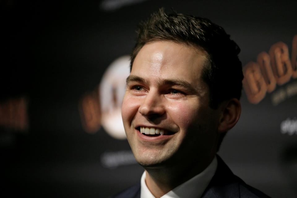 Giants general manager Scott Harris smiles during a news conference after his introduction at Oracle Park Monday, Nov. 11, 2019, in San Francisco. The Giants hired Harris from the Cubs to become general manager, filling a void of more than a year after the club had gone without a GM during president of baseball operations Farhan Zaidi's first season in the position.