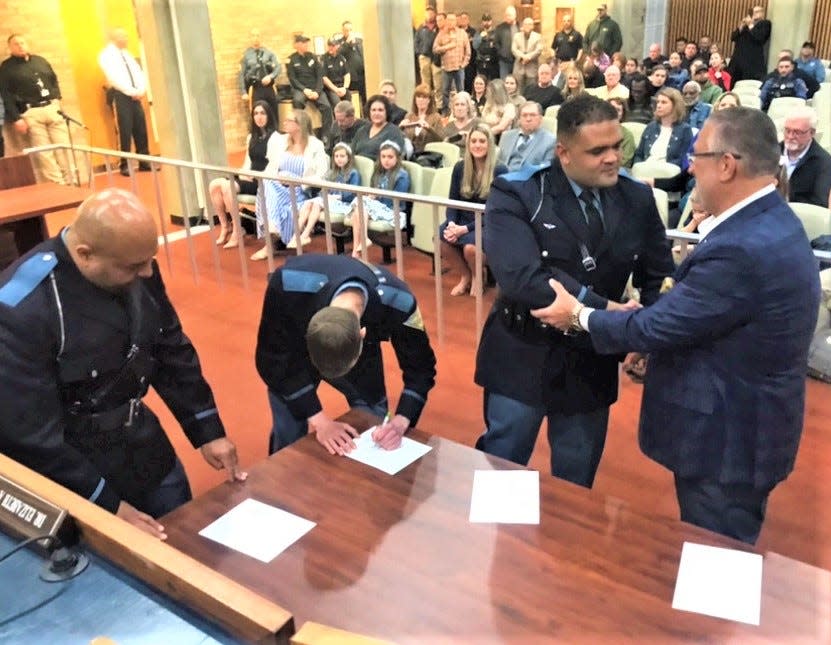Vineland Mayor Anthony Fanucci (right) congratulates newly promoted Sgt. Fred DeMary Jr. at a ceremony Monday morning at City Hall. Left to right are new Sgts. Nelson Gonzalez, Michael Dennis, and DeMary. Six officers in total were promoted. PHOTO: April 8, 2024.
