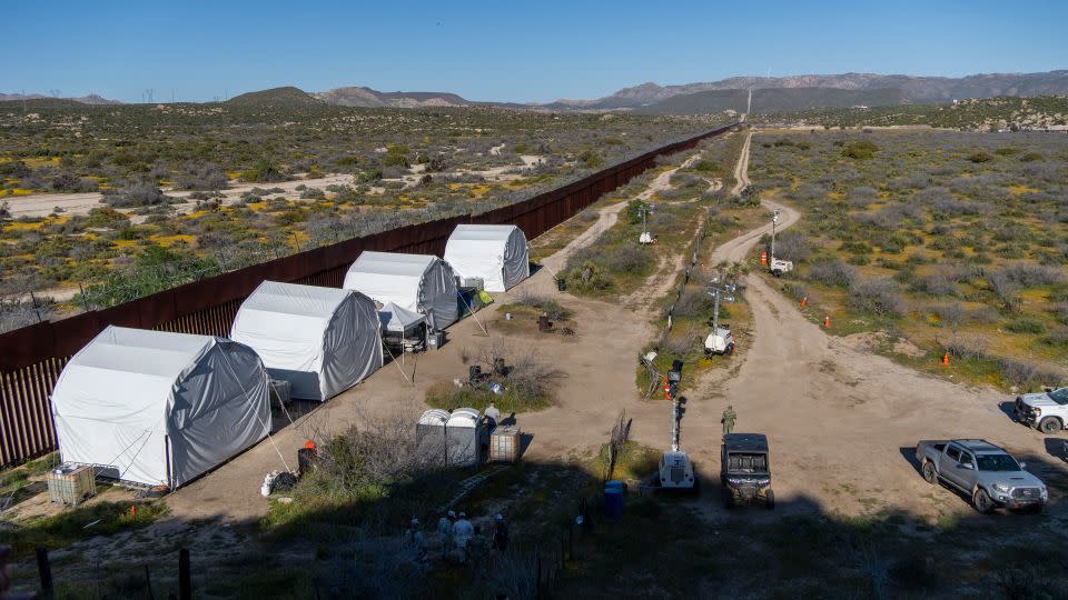 Tents at the border wall become temporary homes for those sent to patrol then land around Ejido Jacumé. - Evelio Contreras/CNN