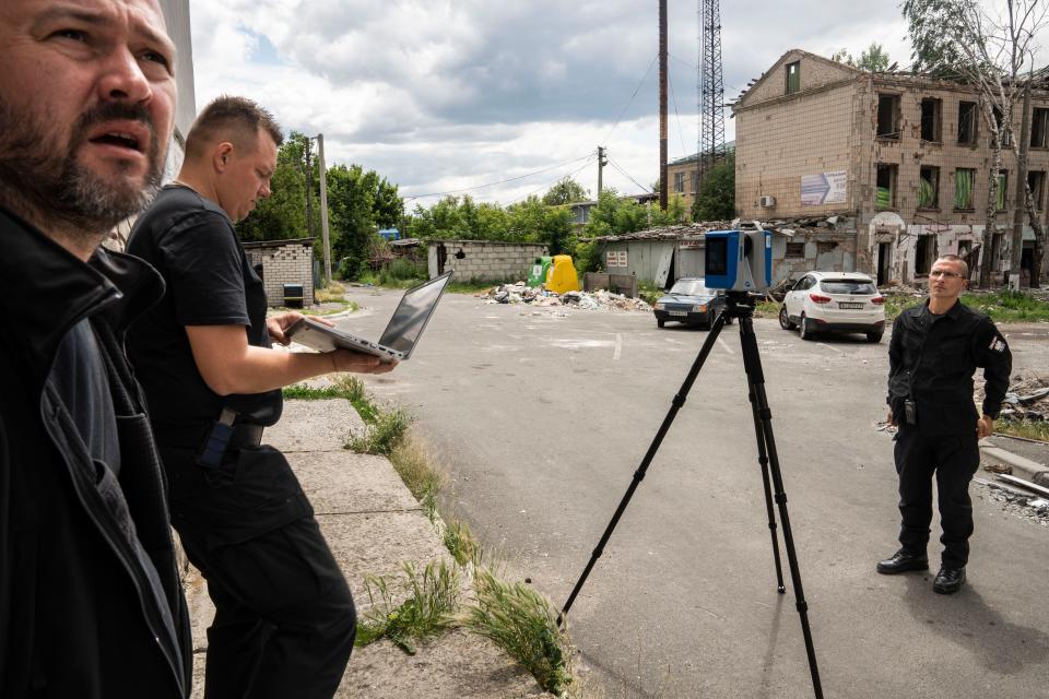 Polish investigators photograph the destruction in Borodyanka, Ukraine. Investigator will use the imagery to create a 3D model of the damage.