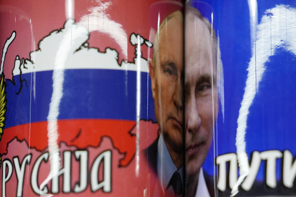 Coffee mugs with a pictures of Russian President Vladimir Putin on sale on the main pedestrian street in downtown Belgrade, Serbia, Monday, Jan. 16, 2023. Since the start of the war in Ukraine, about 200,000 Russians have left their homeland for Serbia, with many seeking a new life in a fraternal Slavic country free from Kremlin oppression. The Balkan country is a close ally of Moscow, with historic, religious and cultural ties, and Russia backs Serbia’s claim over its former province of Kosovo.(AP Photo/Darko Vojinovic)