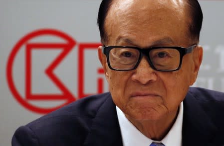 FILE PHOTO: Hong Kong tycoon Li Ka-shing looks on during a news conference announcing the CK Hutchison Holdings company results in Hong Kong