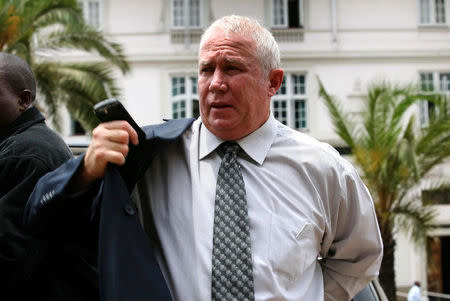 FILE PHOTO: Roy Bennett leaves the High Court building in Harare, November 12, 2009. REUTERS/Philimon Bulawayo/File Photo