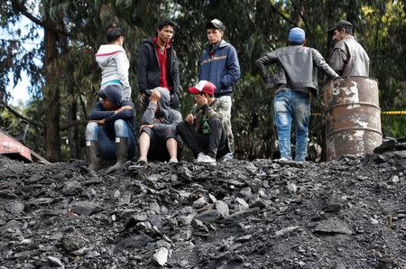 People wait for news of their missing relatives after an explosion at an underground coal mine on Friday, in Cucunuba, Colombia June 24, 2017. REUTERS/Jaime Saldarriaga