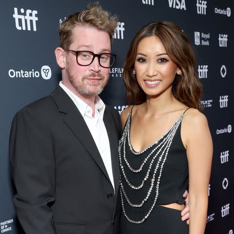 <p>Robin Marchant/Getty </p> Macaulay Culkin and Brenda Song