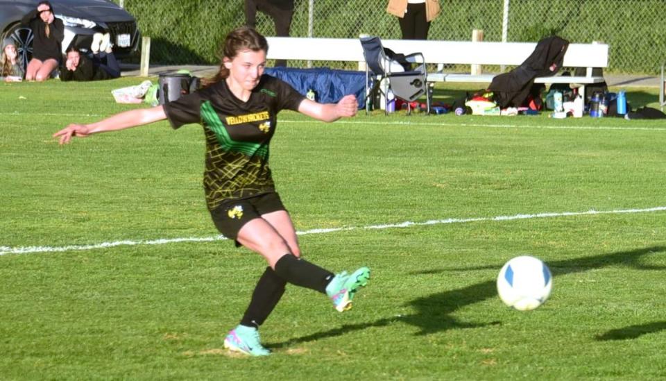 Hilmar High sophomore Sidney Logsoon (19) fires in the winning goal on a penalty kick against University Prep during the Northern California Regional Division V semifinal match on Thursday, Feb. 29, 2024 at Hilmar High School.