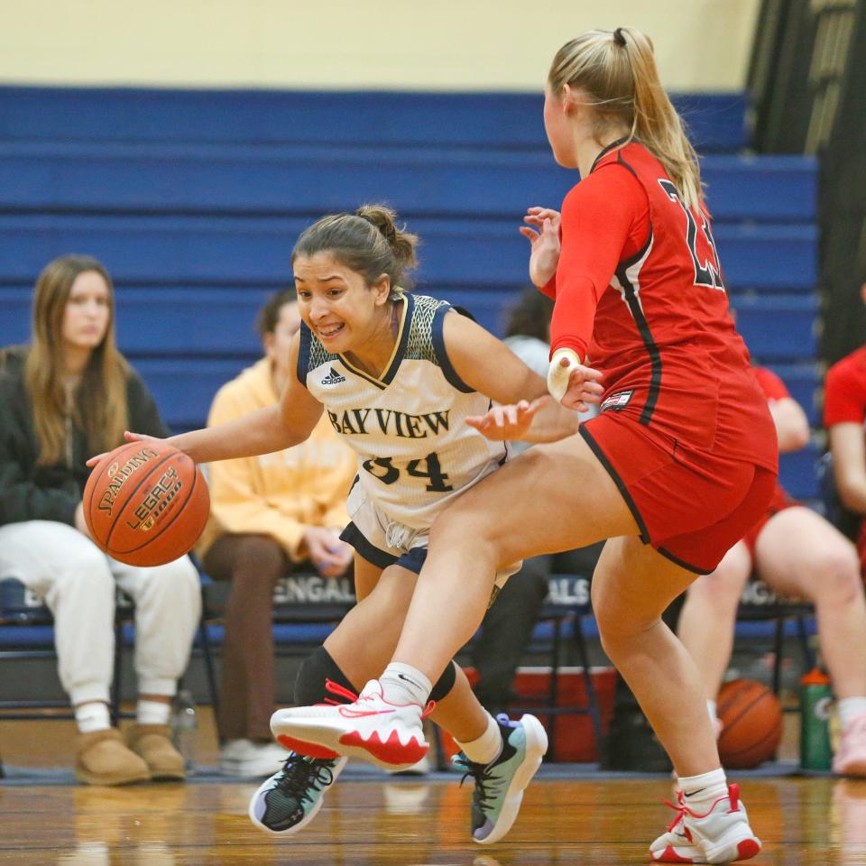 Sofia Moreno (left) and the Bay View girls basketball team looked for space to work against a tough Cranston West defense, but didn't get things going until late in Friday's win.
