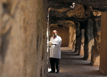 An Egyptian archaeologist works inside one of the largest newly discovered pharaonic tombs "Shedsu Djehuty" in Luxor, Egypt April 18, 2019. REUTERS/Mohamed Abd El Ghany