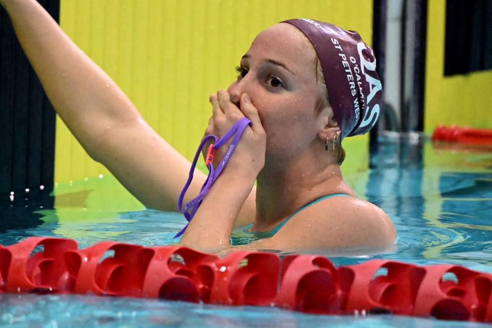 Mollie O'Callaghan celebrates after winning the 200m freestyle.