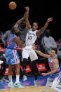 San Antonio Spurs' DeMar DeRozan (10) passes away from Brooklyn Nets' James Harden (13) and Landry Shamet (20) during the second half of an NBA basketball game Wednesday, May 12, 2021, in New York. (AP Photo/Frank Franklin II)