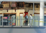 <p>Forensic personnel stand on a bridge which links Victoria railway station to the Manchester Arena in central Manchester, Britain, Tuesday May 23 2017. (AP Photo/Rui Vieira) </p>