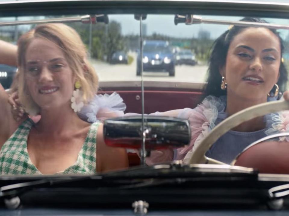 eleanor and drea riding in a vintage convertible at the end of do revenge