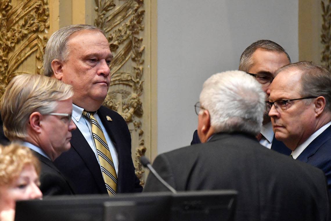 Kentucky State Senator Robert Stivers, rear left, speaks with a group of Senators during a recess of their session at the Kentucky State Capitol in Frankfort, Ky., Thursday, March 16, 2023. (AP Photo/Timothy D. Easley)